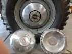 Pontiac hubcaps welded to Land Cruiser hubcap base